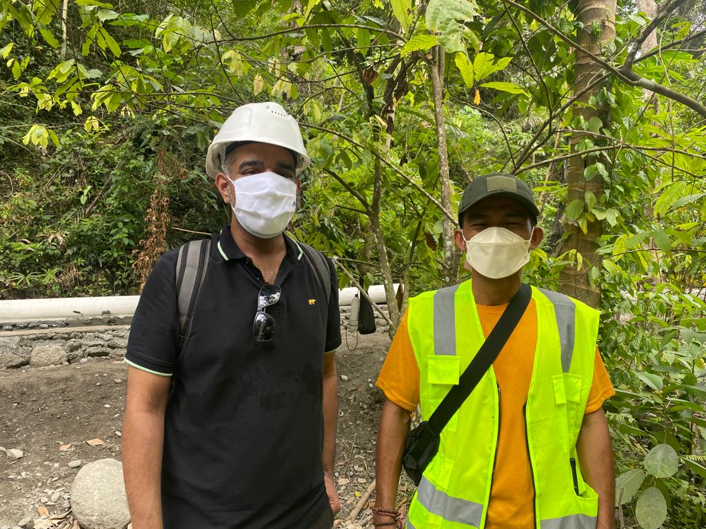 Ranjit Jose-left- visits a vital irrigation canal with the Head of Jono Village, Sigi District, Central Sulawesi, Indonesia.