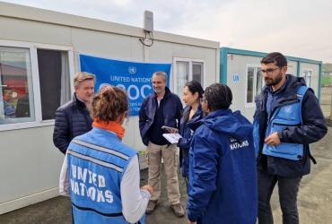 Fatma Aslan Uçar (left) and Velat Özalp (far right) are committed national UN Volunteers who have played critical roles in OCHA's earthquake response and recovery efforts. 