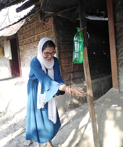 UN-Community-Volunteer-Tanjina-Aktar-Dina-is-demonstrating-and-encouraging-effective-handwashing-at-her-community-in-Chattogram.jpg