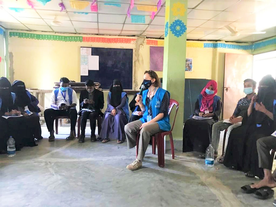  UN Volunteer Jana Lejskeová (Czech Republic), UN Volunteer Associate Education Officer with UNHCR, conducting a session on education, improving inclusion and ensuring that more women and girls have access to education at a refugee camp in Cox’s Bazar.