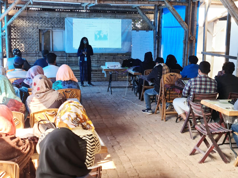 National UN Volunteer Samia Aboni, Knowledge Management and Reporting Officer with UNICEF, conducting training on bathing facilities research and advocacy for Rohingya refugees, together with the Needs and Population Monitoring team of IOM.