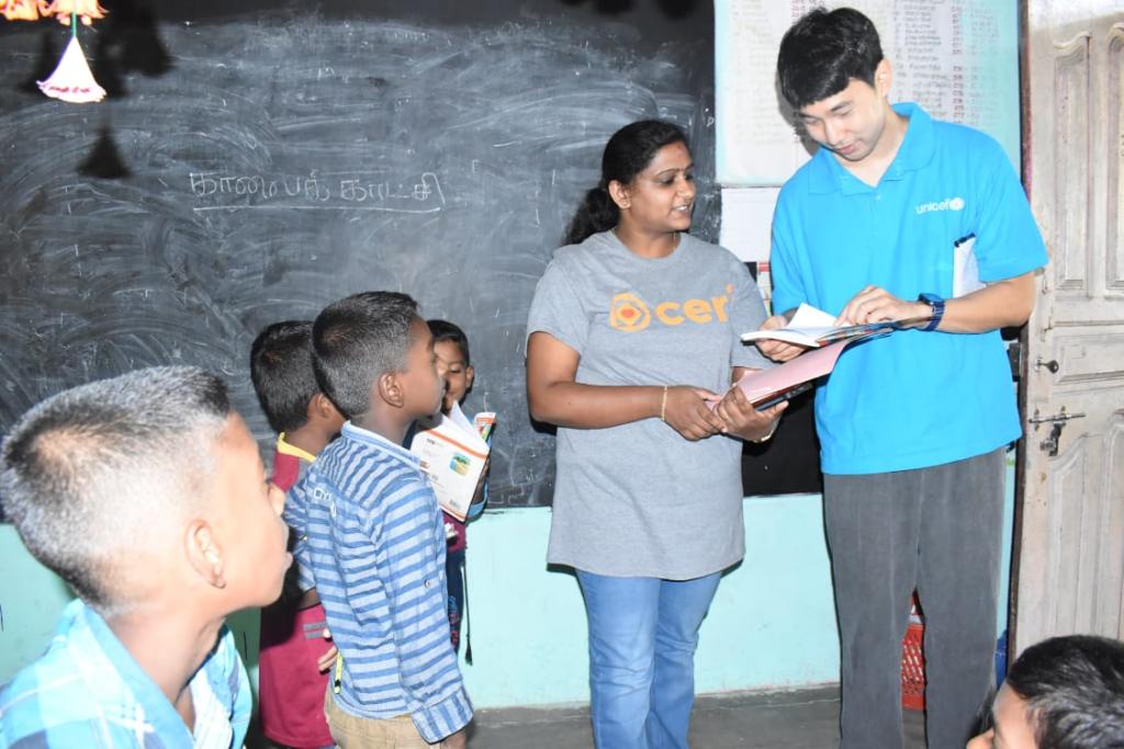 Kyoreh Yoo (standing at the far right) at a field visit to Muthalaikkudah school to monitor the progress of basic numeracy and literacy boost programme for children ©UNICEF Sri Lanka