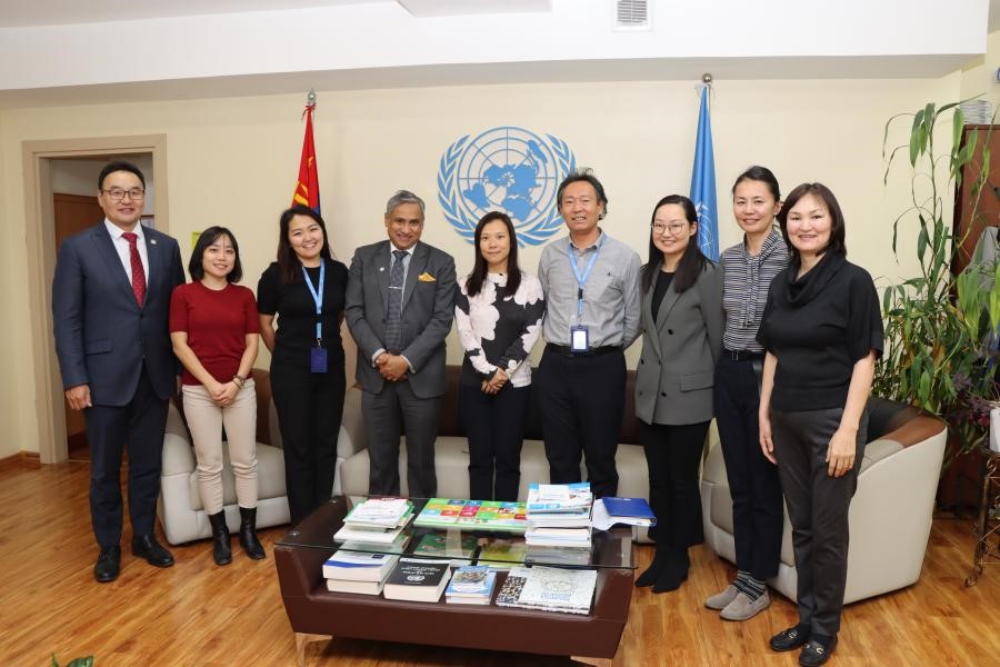Kana Endo (second from left), International UN Volunteer serving as Communication and Advocacy Assistant with UN RCO in Mongolia pauses with colleagues at the Resident Coordinator’s Office - November 2022