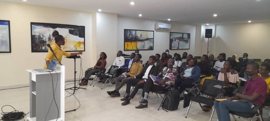 UN Youth Volunteer, Mercy Melody Kayodi, training young professionals on how to integrate SDGs into their work, at the office of Association of Community Based Leaders in Kampala, Uganda. 