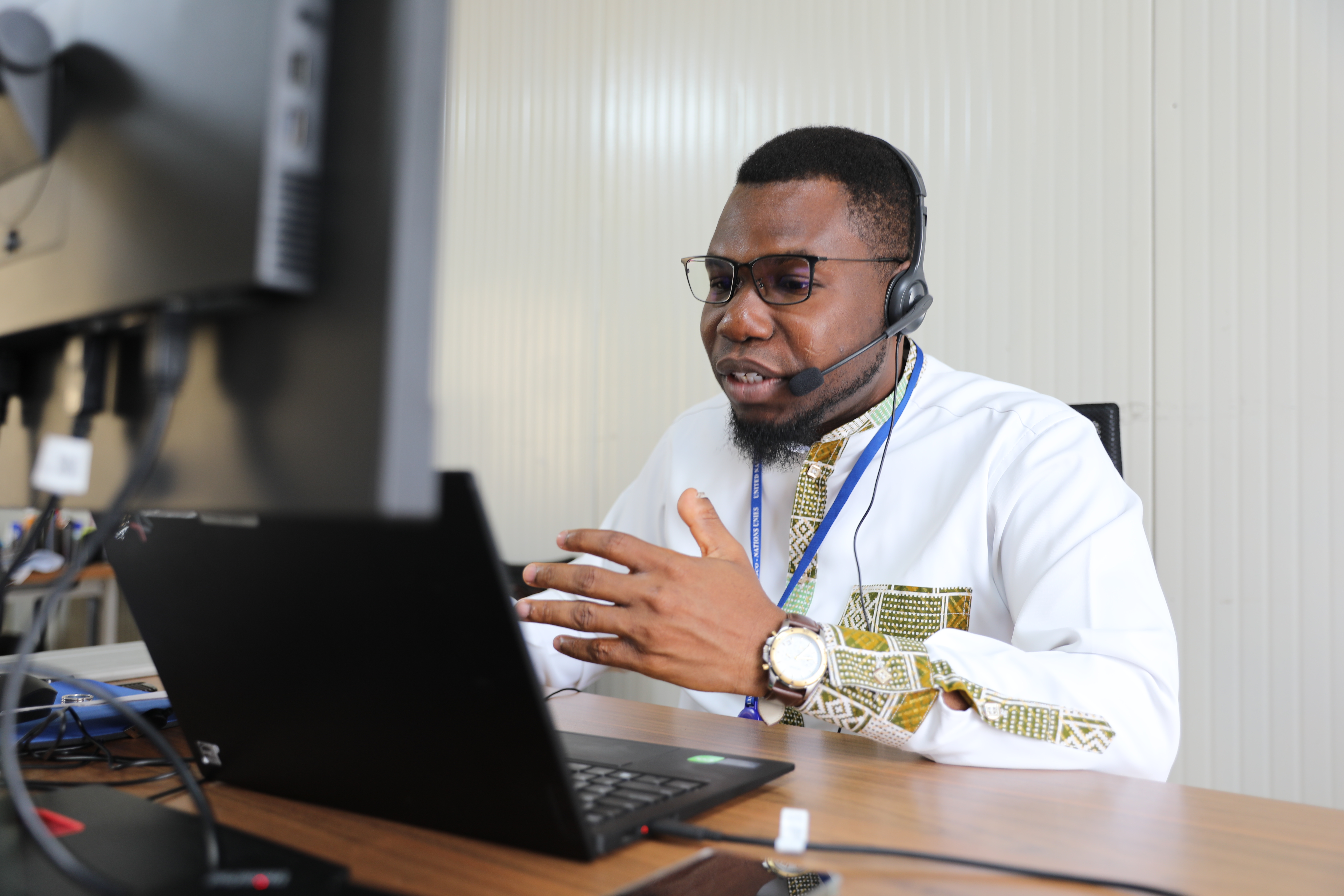 UN Volunteer Interpreter/Translator Appolinaire Fachehoun during an assignment at MONUSCO in Kinshasa, supporting multilingual communication and dialogue across the Mission’s operations in the DRC.
