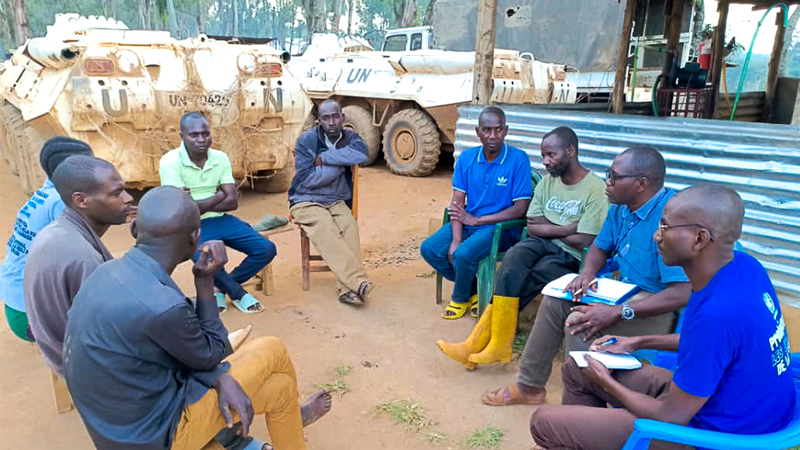 UN and community representatives meet with members of the management committee at the Dro Dro displacement site in Ituri Province to discuss child protection and community needs.
