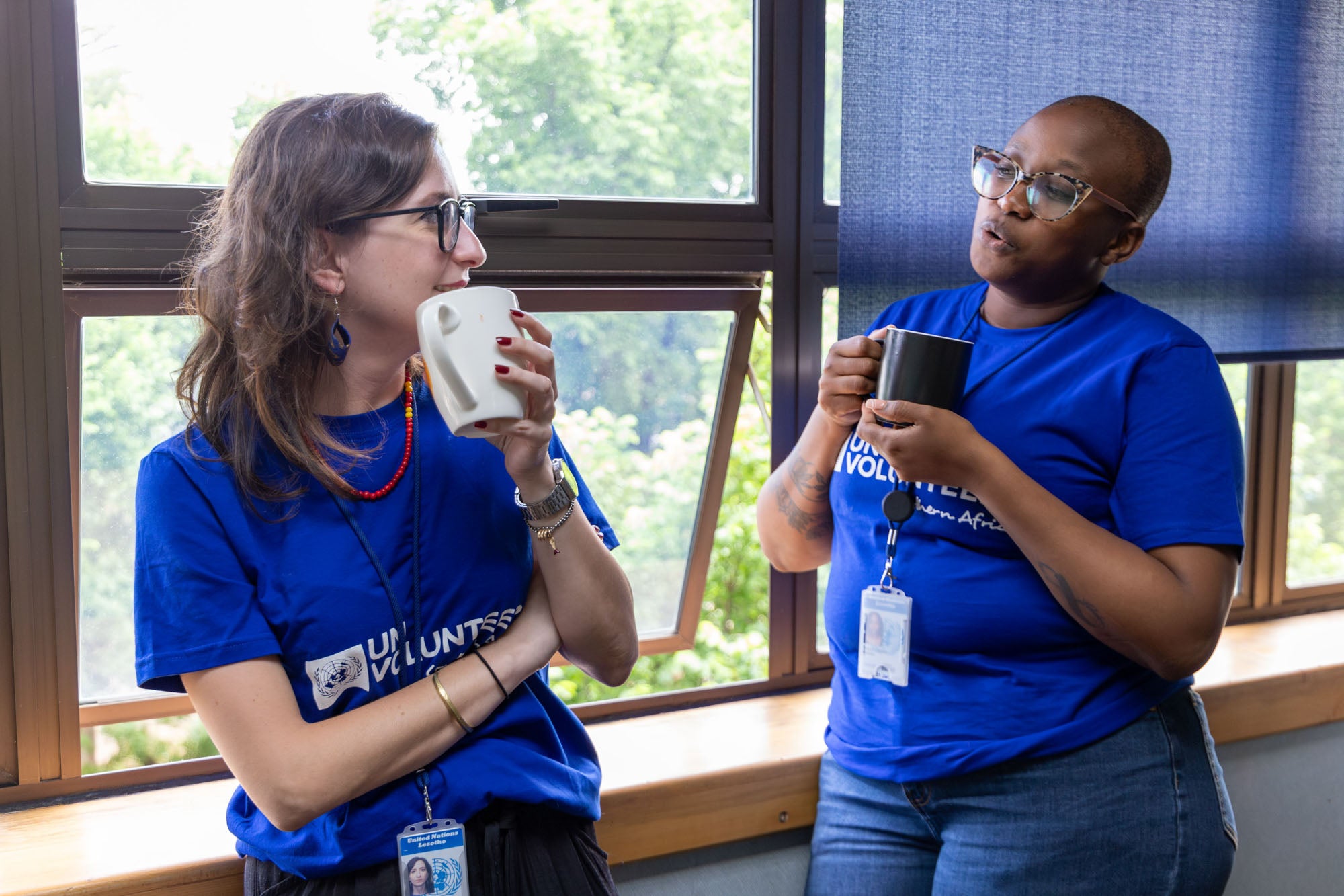 Francesca Conte (left, with white mug), a Social Policy Officer at UNICEF Lesotho enjoys a cup of coffee with Teboho Rabale, a collegue during a break