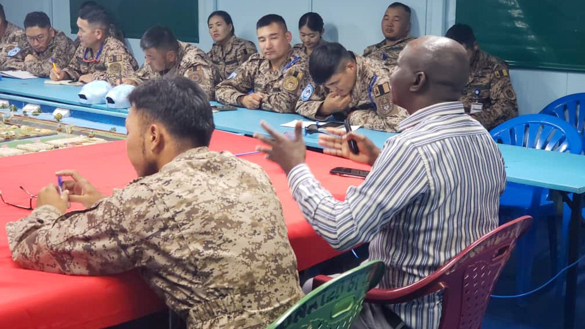 Morris Charumbira (second from left, in civilian clothing) making a presentation during induction of millitary personnel at Monbatt in Bentiu_Unity State