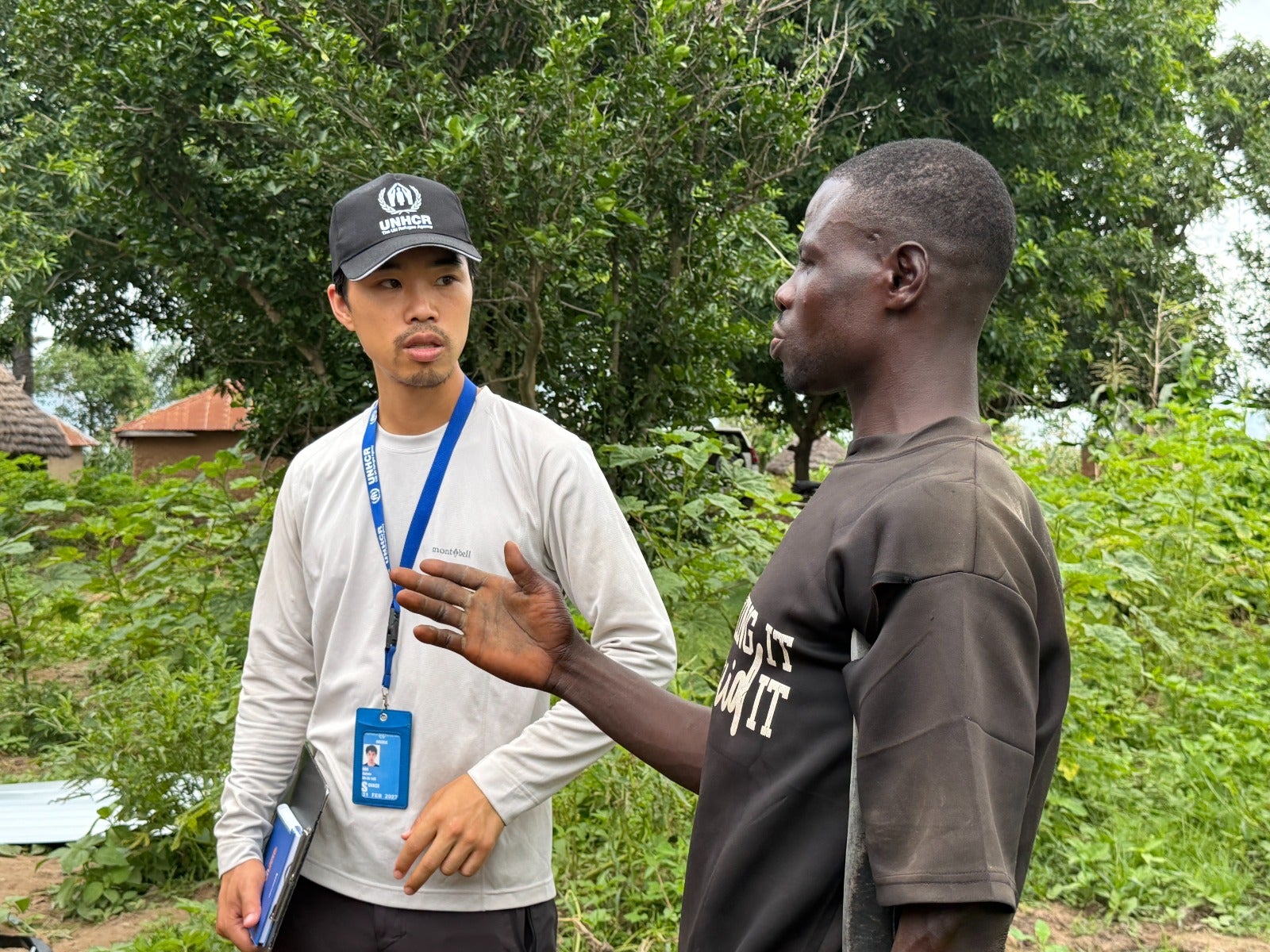 UN Volunteer Gakuto Han speaks with a resident affected by displacement during a needs assessment in Akpagher, Mbalagh Council Ward, Makurdi, Nigeria.