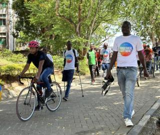 UN Volunteers Kenya during IVD activity, showing solidarity to persons with disabilities - a walk to raise community awareness about disability inclusion from Tom Mboya School of Cerebral Palsy to the Technical University of Mombasa. 