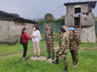 Nusrat Shaheen (left), UN Volunteer Environment and Waste Management Specialist, during a monitoring visit to the BEC camp Muningi in Goma, Democratic Republic of the Congo.