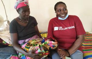 Dr Bako Sonia (right), UN Volunteer Obstetrician and Gynaecologist, with a patient who had a cesarean section at the Buba Health Centre.