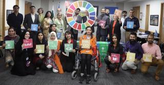 Ezat Ullah, national UN Volunteer Social Inclusion Officer and Youth Empowerment (second row, first from right) with the UNDP Islamabad Youth Empowerment Programme team on the occasion of introducing Fawad Khan, a well-known Pakistani actor and singer, as a UNDP Good Will Ambassador. ©️UNV, 2022