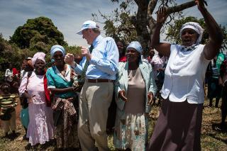 UNV Executive Coordinator shares a dancing moment with community volunteers and members in Donga farm, Kenya.