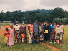 UN Youth Volunteer Fannie Elvejung (holding a yellow folder) meets communities to assess their needs with UNDP Cameroon.
