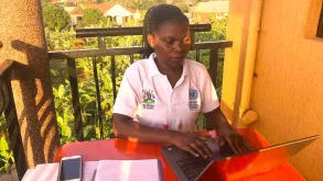 Annet Nakaliti, national UN Volunteer with UNFPA in Uganda, working from home due to impact of COVID-19.