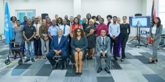 UN Volunteer with UNESCO, Arita Arania Phillip (right), at a workshop in Antigua and Barbuda, which engaged over 500 Caribbean youth on digital literacy, misinformation, mental health and cybercrime.