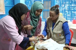 UN Volunteer Sitara Khatiwada (right) during a capacity building session at a Rohingya Refugee Camp in Cox’s Bazar, Bangladesh
