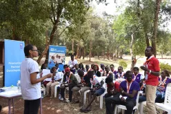 Barbra Matu, national UN Volunteer with UNEP, is interacting with a participant during the Kenya Scouts training (2017).