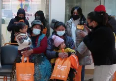 Mayra Adriana Lopez Diaz (right), a UN Volunteer Local Monitor for Reproductive and Sexual Rights serving with UNFPA in Bolivia, supports menstrual health and hygiene among adolescent girls and women in La Paz.
