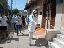 Community volunteers in India support sanitary workers.