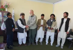 Barry Greville-Eyres (third from left), International UN Volunteer with UNDP shakes hands with the District Governor, Bamyan Province, Afghanistan.
