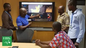 Jean Paul Kimenyi, UN Volunteer Epidemiologist at WHO Congo presenting analysis on new risks of disease outbreak in Congo.