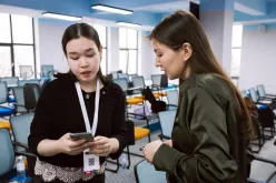 Dilyara Begalykyzy (left) UN Youth Volunteer Event Planning Assistant at the UNDP Accelerator Lab during an event preparation.