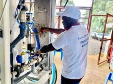 Joseph Wilner, UN Volunteer Water and Sanitation Technician, checking a MONUSCO water treatment plant in Bukavu, Democratic Republic of the Congo.