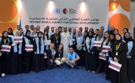 Toily Kurbanov, Executive Coordinator of UNV (front center), with UN Volunteers at the Second World Summit for Social Development in Doha.