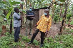 Dominic Lomongin Aballa (centre) is a UN Volunteer Water, Sanitation and Hygiene (WASH) Officer with the UN Children's Fund (UNICEF) in Mbarara, Uganda. Here he interacts with community members during a field visit in Isingiro District, in March 2022.
