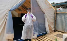 Dr. Rudolf Maulany coordinating Covid19 screening activities  in Rumbek Clinic Triage tent