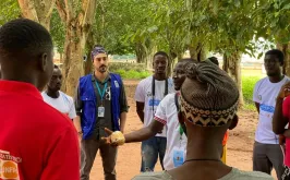 Christian Menin, UN Volunteer Project Manager for Rule of Law and Security with UNDP Guinea-Bissau, engages with community members during a field activity in the Bolama Region.