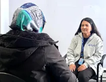 Karuna Kunwar (right), international UN Volunteer Staff Counsellor with UNAMA discusses mental health with UN personnel in Kabul.