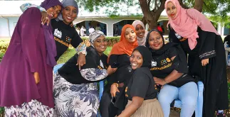 Aisha Hussein (centre, with orange scarf) and her team from Every Girl’s Dream pose for a picture during the anti-FGM youth caravan in Isiolo county, Kenya.