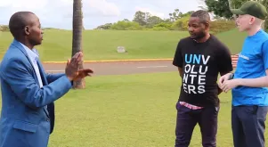 Moses Chubili (left), national UN Volunteer Coordination and Partnership Officer in Zambia, converses in sign language with Gift Govere (right), national UN Volunteer Project Officer in Zimbabwe, on the sidelines of a UN Youth Volunteer workshop held in Nairobi, Kenya. Moses and Gift serve under the UNDP/UNV Talent Programme for Young Professionals with Disabilities.