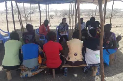 Akie Tanaka, UN Volunteer Associate Field Officer with UNHCR in Kakuma, camp, Kenya, during a focus group discussion in the community.