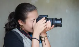 Alana Foley Pradhan, UN Volunteer Knowledge Management Officer captures photos, interviews, and dialogues in an interagency mission with UN Women in Liberia.