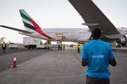 Lucas Odhiambo monitors the offloading of a shipment of over 880,000 Moderna COVID-19 vaccines donated by the United States at Jomo Kenyatta International Airport in Nairobi, Kenya.