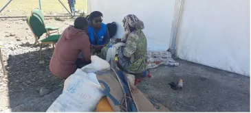Lynn Karanja (in blue jacket), Associate Mental Health and Psychosocial Support Officer, UNHCR Ethiopia engages with a refugee woman in Alemwach Refugee Site to identify her needs and link her with the appropriate services.