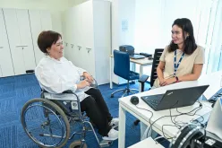 UN Volunteer Madina Karsakpayeva meeting with colleagues at the UN House, Almaty office, and discussing initiatives for inclusive higher education.