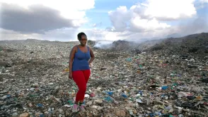 Mercy Ochieng Odhiambo, national UN Volunteer Community Specialist with UN-Habitat, at a dumpsite in Nairobi to meet with waste pickers and hear about their challenges.