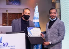Tunisian volunteer Mohamed Guediri (right) receiving an award for inspiring new forms of volunteering through innovation.