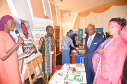 Nafissatou Seck (left), national UN Volunteer Gender and Gender-based Violence Specialist, presents UNFPA's mandate and flagship initiatives to Senegal's Minister of Foreign Affairs, Me Aissata Tall Sall, during the celebration of United Nations Day on 27 October 2022.