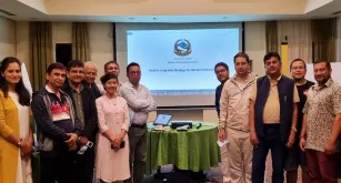 Rassu Manandhar (centre), national UN Volunteer Specialist with UNDP, during the finalization of the Long-Term Strategy for Net Zero Emission of Nepal, with counterparts and experts from the Ministry of Forests and Environment, UNDP, and the Commonwealth and Development Office.