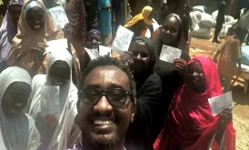 UN Volunteer Tiruneh Debena after validation of the beneficiary targeting and monitoring the distribution of food inputs to conflict-affected communities in Yola, Adamawa State, North-East Nigeria.