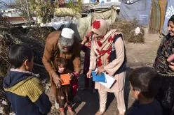 Andleeb Afzal (centre), national UN Volunteer Monitoring and Data Support Assistant with WHO, while gathering data in Muzaffarabad, Azad Jammu &amp; Kashmir District, Pakistan.