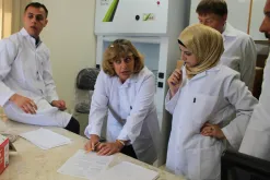 Forensic expert from the Palestinian Forensic Laboratory working analysis of samples of drugs and chemicals