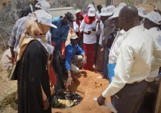 UNAMID UN Volunteer Abu Bakarr Bangura instructs youth group members from an Internally Displaced Person camp in Darfur on techniques for small scale composting