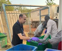 Bilel Dhouib (left) UN Volunteer Environmental Education Officer in a waste assessment exercise in UNMISS field location in South Sudan.